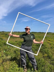 Guthrie holding a transect